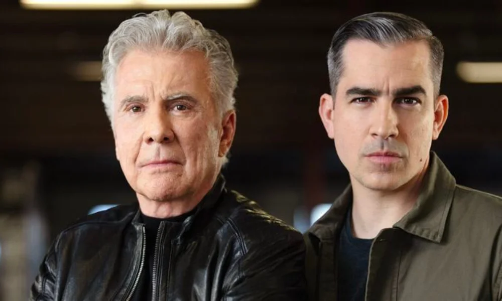 Two men standing side by side with serious expressions
