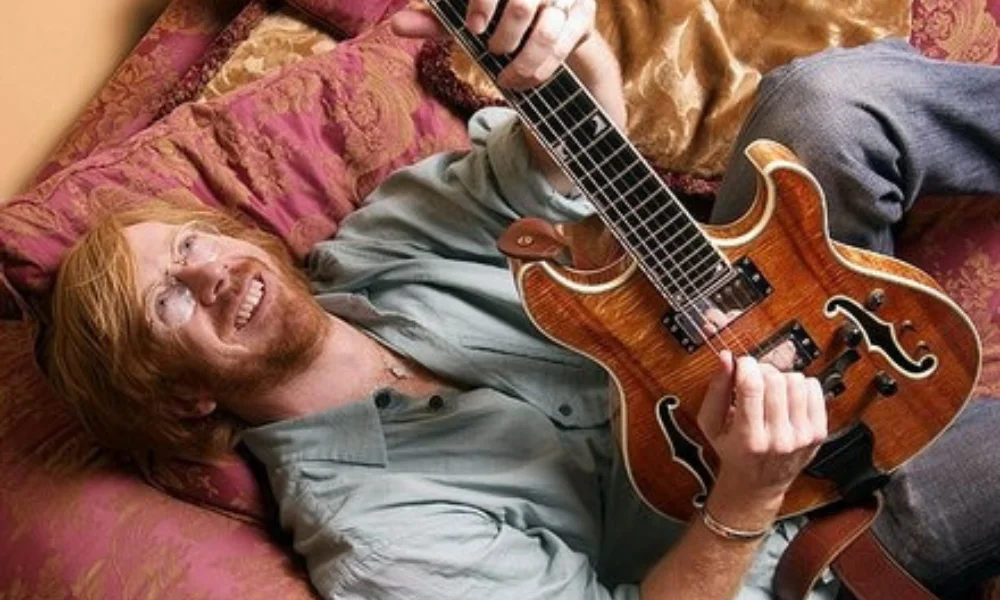 A person with long reddish hair-trey anastasio net worth
