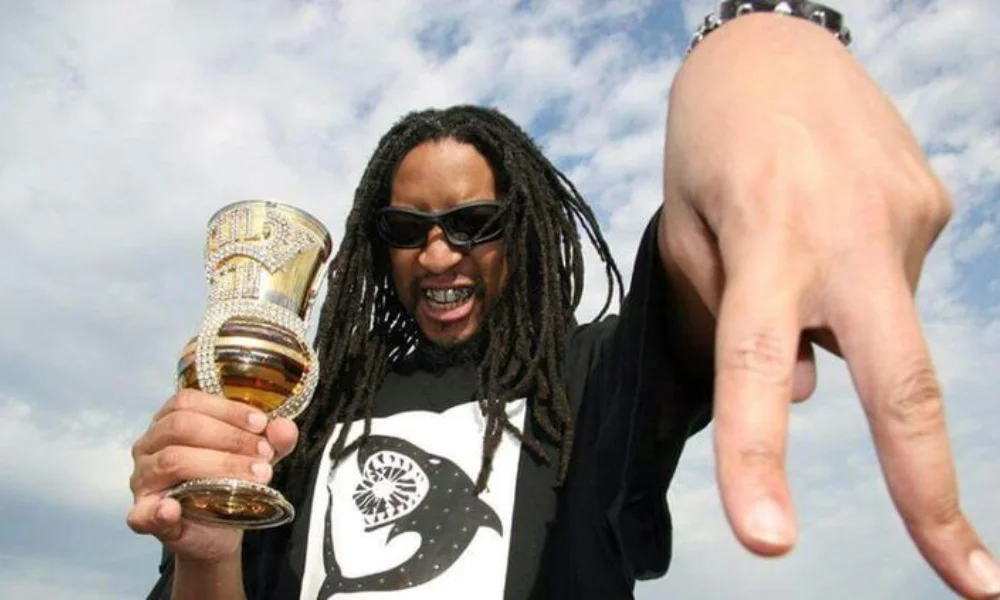 Man with dreadlocks and sunglasses holds a jeweled cup-lil jon net worth