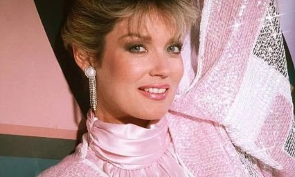 Smiling woman in glamorous 80s fashion-mary hart's net worth
