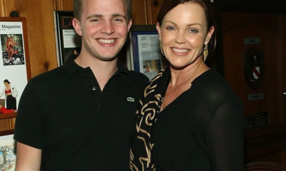 A smiling woman and man pose together