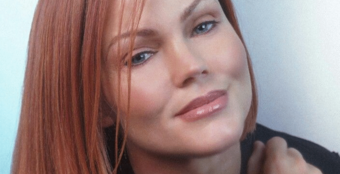 A person with short, straight red hair