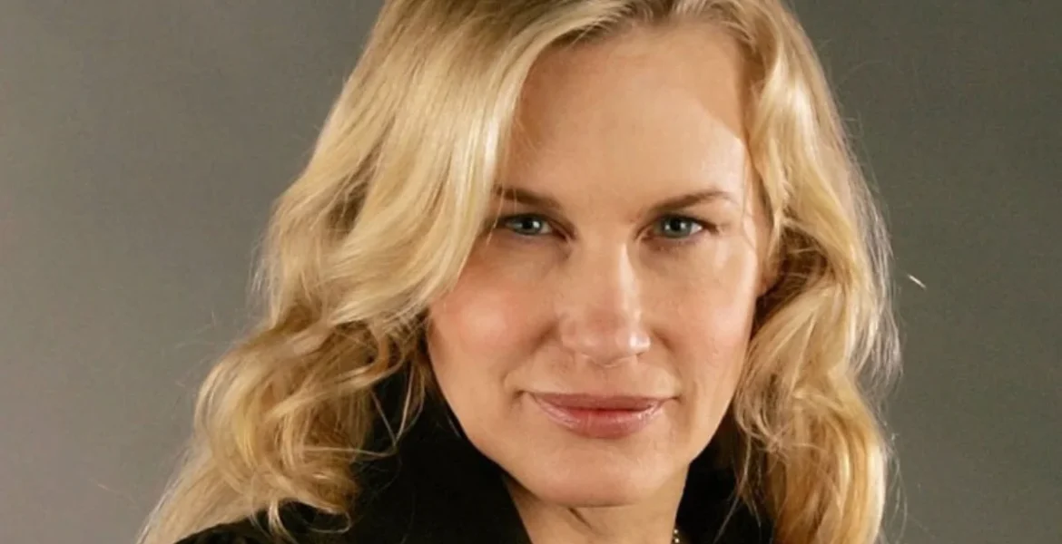 A person with long, wavy blonde hair