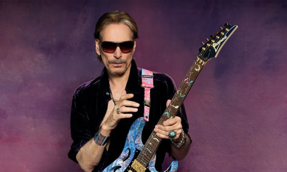A man with sunglasses and a confident expression