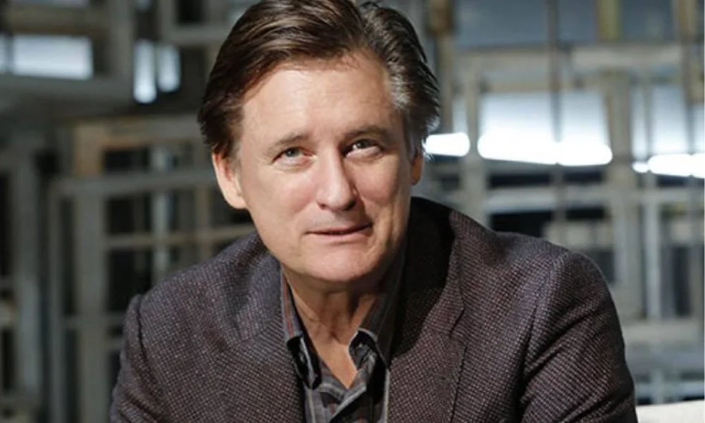 A middle-aged man with dark-bill pullman net worth