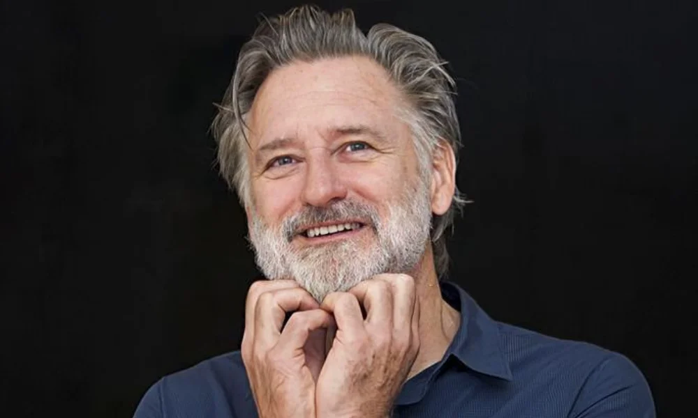 Smiling man with gray beard-bill pullman net worth
