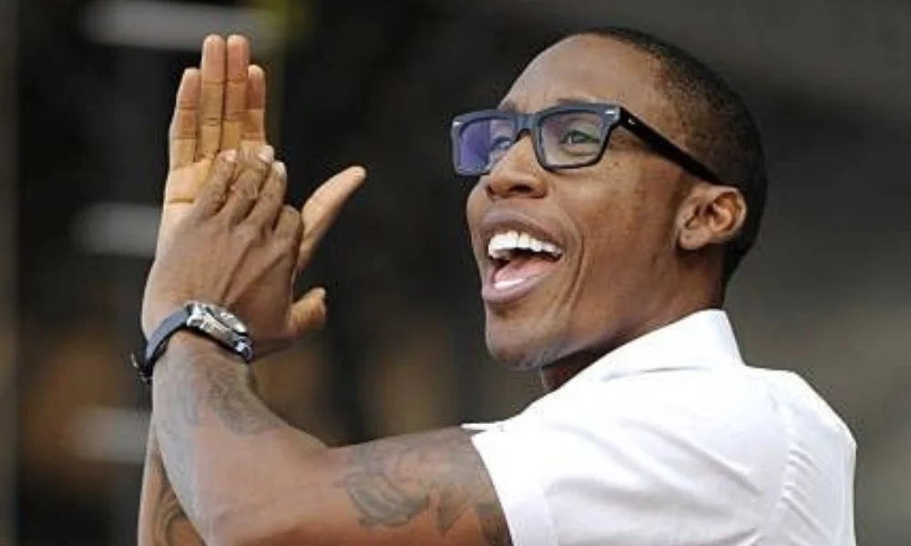 A person wearing glasses and a white shirt-raphael saadiq net worth