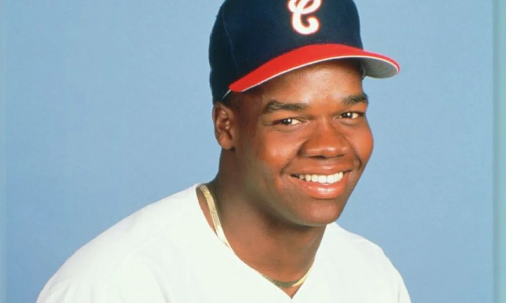 Smiling man in a baseball uniform with a blue cap-frank thomas net worth