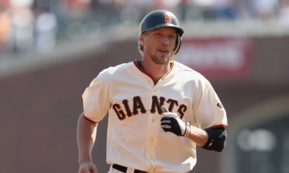 Baseball player in a Giants uniform runs-hunter pence net worth