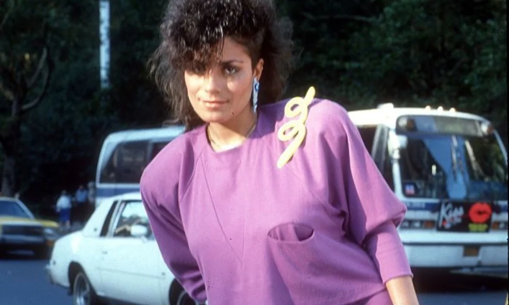 Woman in a purple 1980s outfit-lisa velez net worth