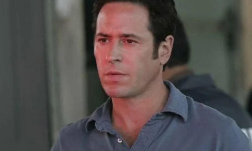 A man with short dark hair looks focused-rob morrow net worth