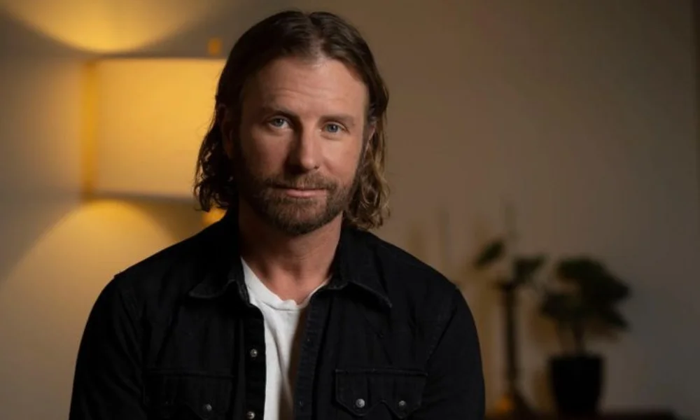A man with shoulder-length hair and a beard-dierks bentley net worth