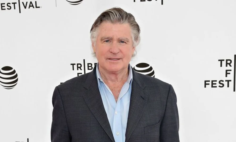 Older man with gray hair wearing a dark blazer-treat williams net worth