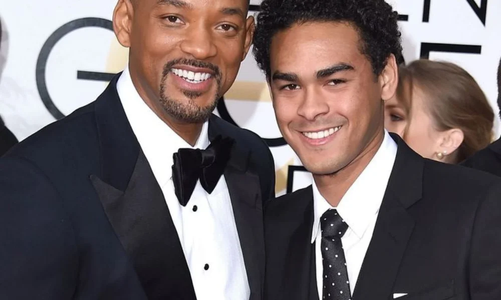 Two people in formal wear smiling at a glamorous event-trey smith net worth