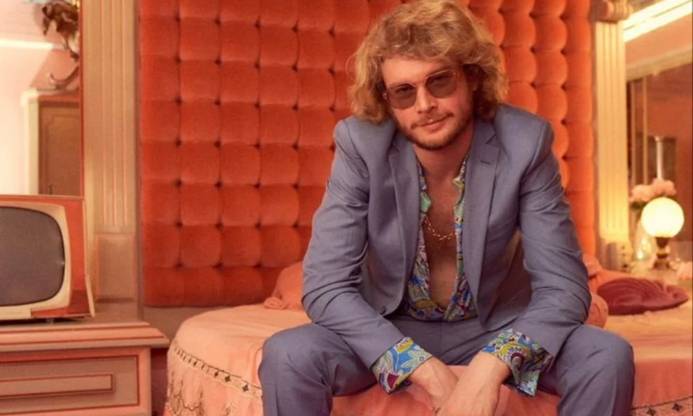 A man in a light blue suit