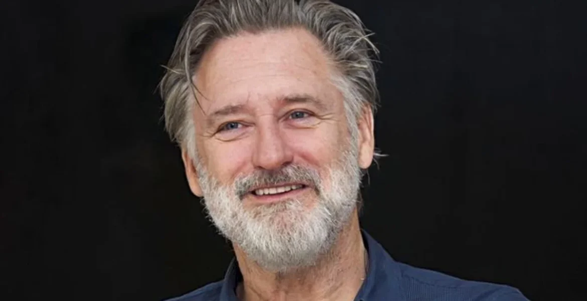Smiling older man with a gray beard