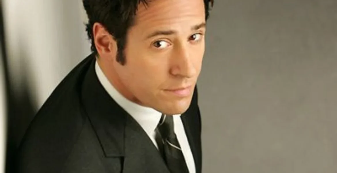 A man in a black suit