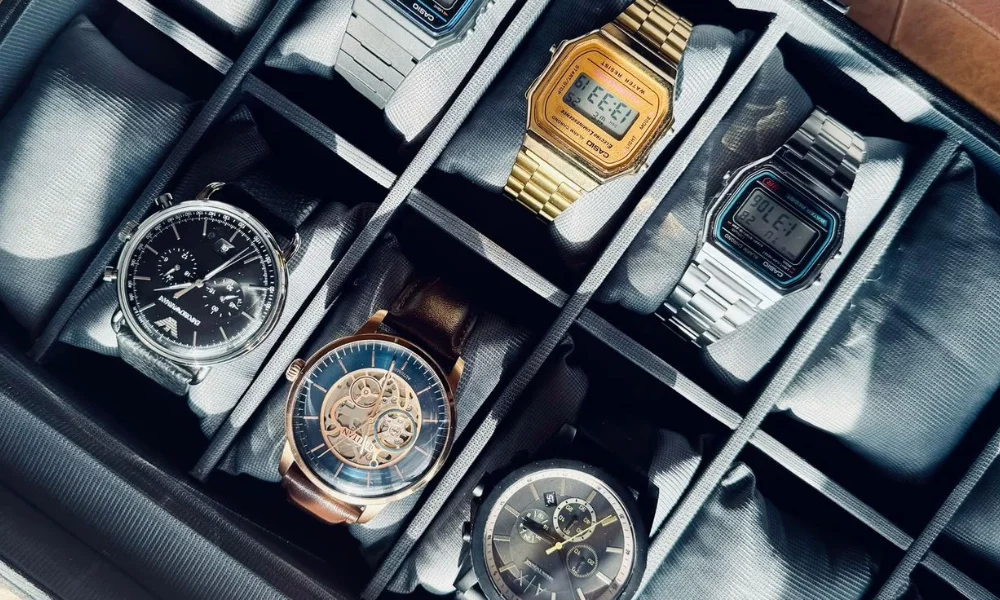 A neatly arranged watch case holds six wristwatches