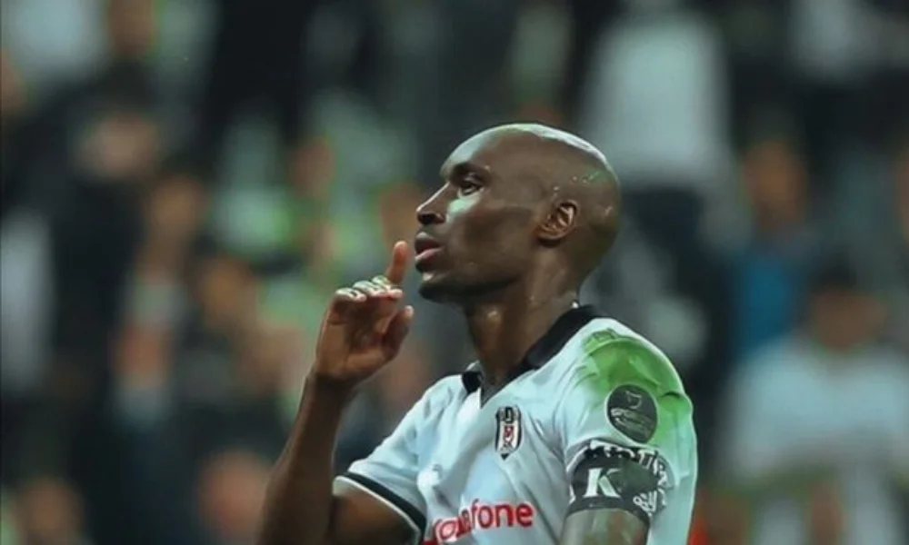 A soccer player in a black and white jersey-ryan babel net worth