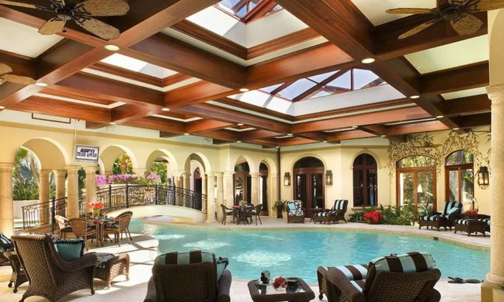 Luxurious indoor pool area with skylights