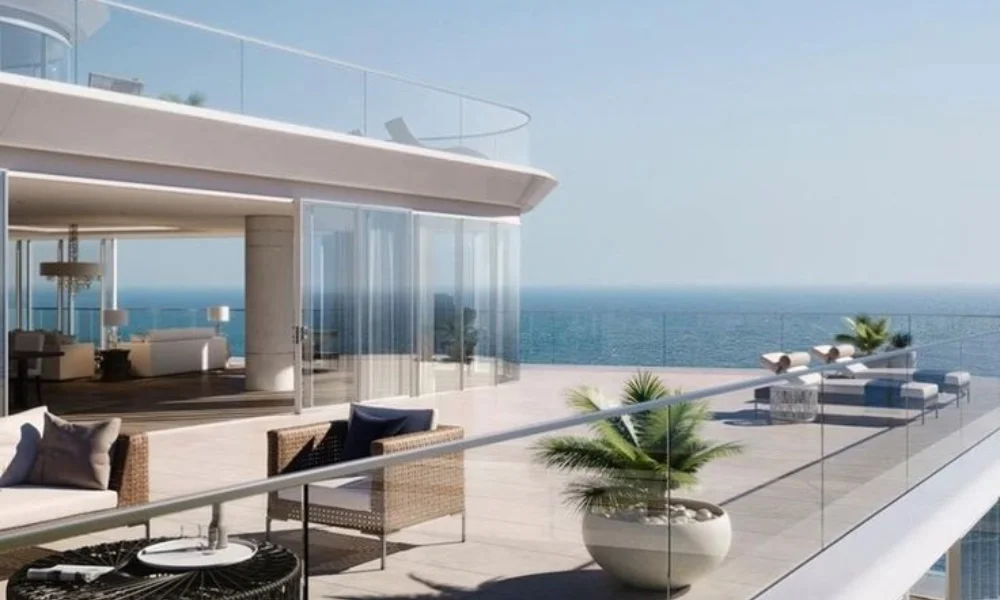 Luxurious oceanfront terrace with wicker chairs