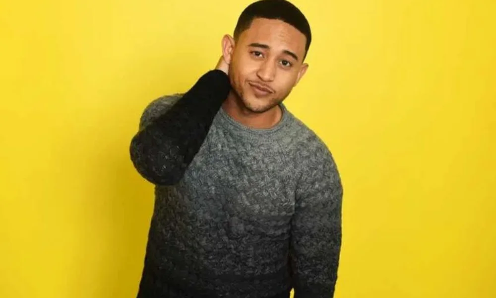 A man in a gray sweater 