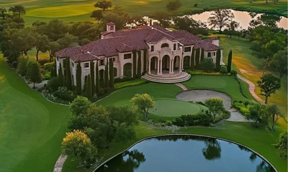 Aerial view of a grand mansion with a terracotta roof-waterfront luxury property