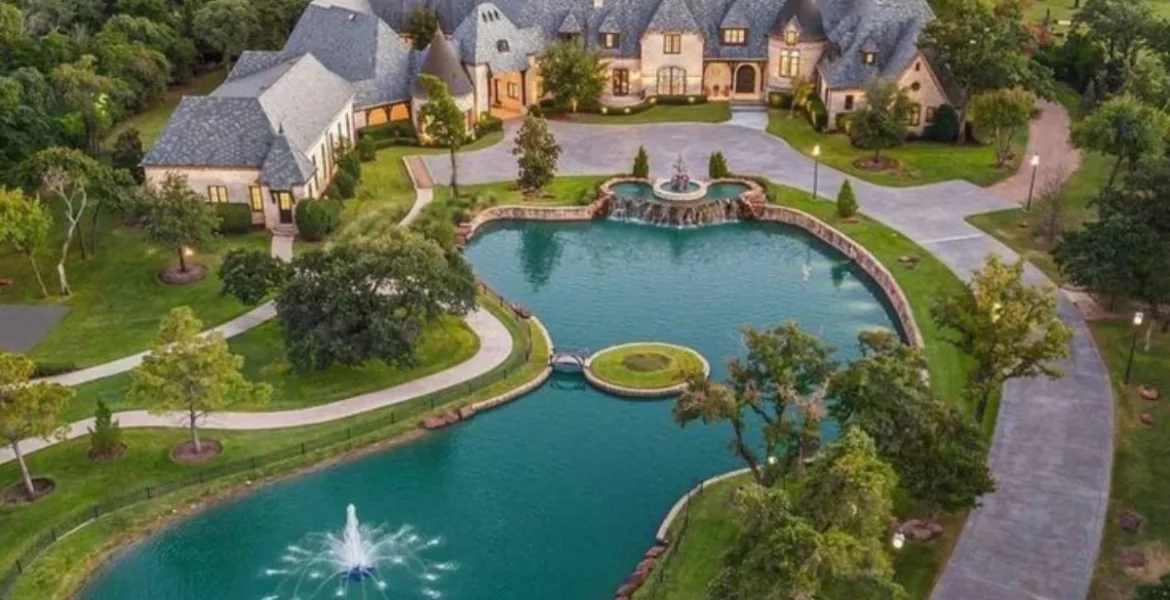 Aerial view of a large mansion with slate roof